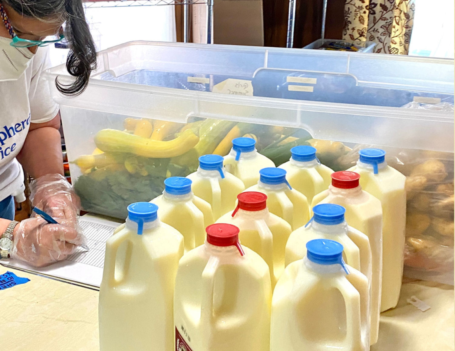 Distributing milk at Shepherd's Office