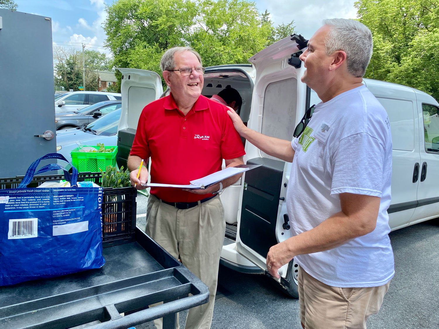 Jerry Brainard and-Lewis Dawley JR greeting each other at Salvation Army in Seaford, DE