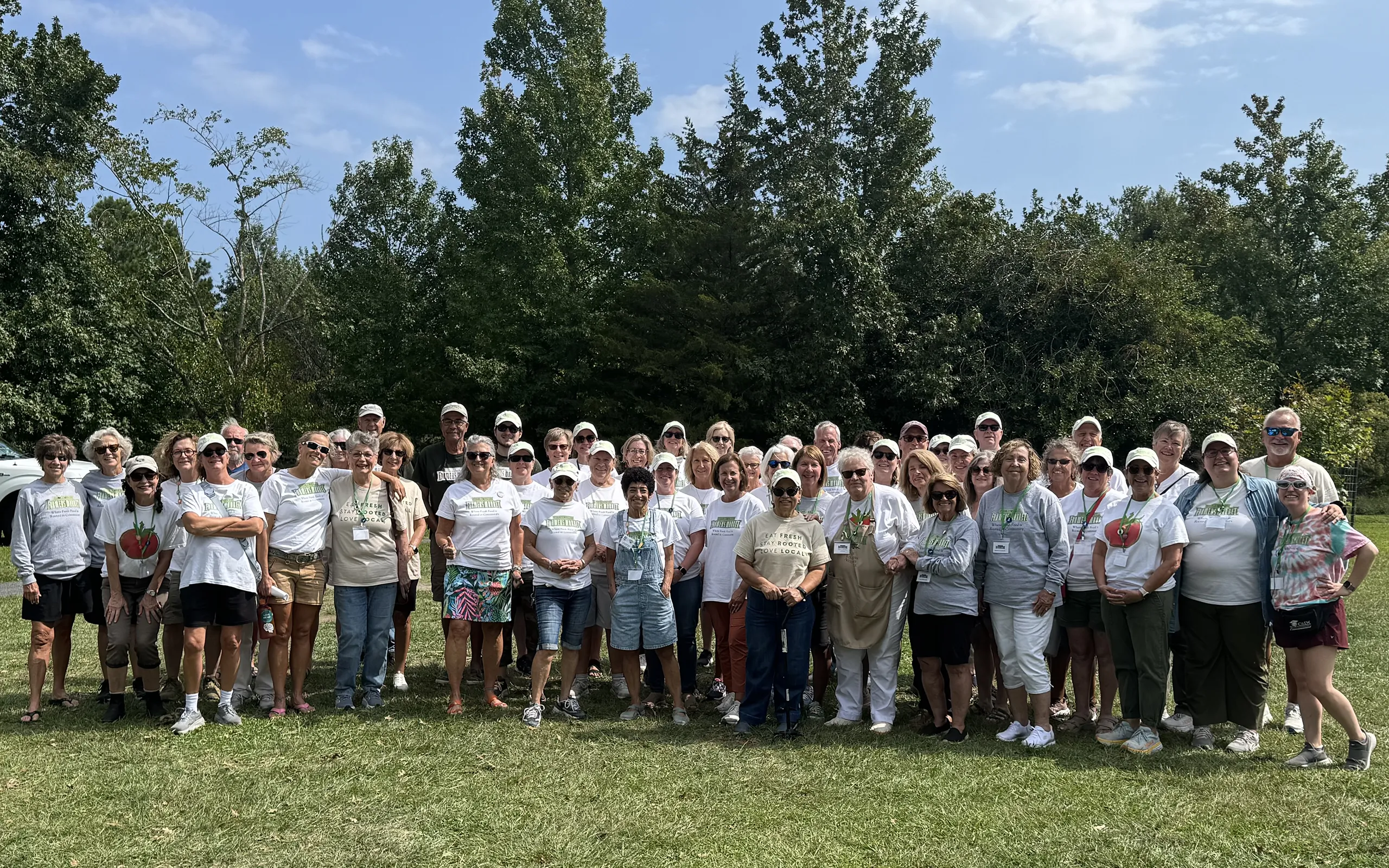 Large group photo of HLFM volunteers smiling