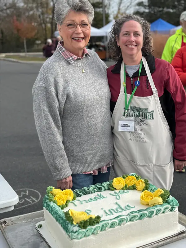 Photo of retiring volunteer coordinator and new volunteer coordinator
