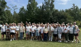 Large group photo of HLFM volunteers smiling